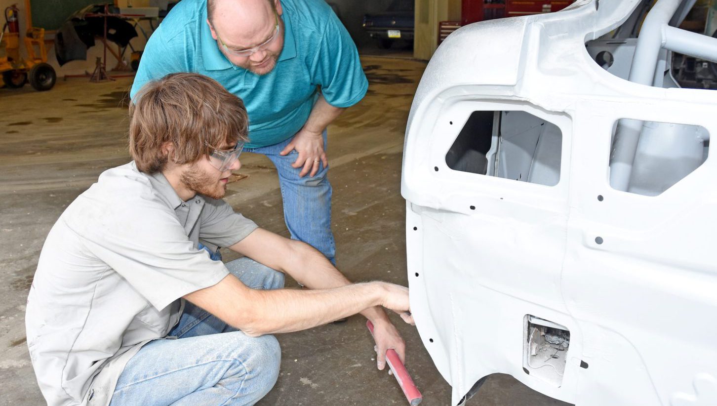 Student repairing collision damage