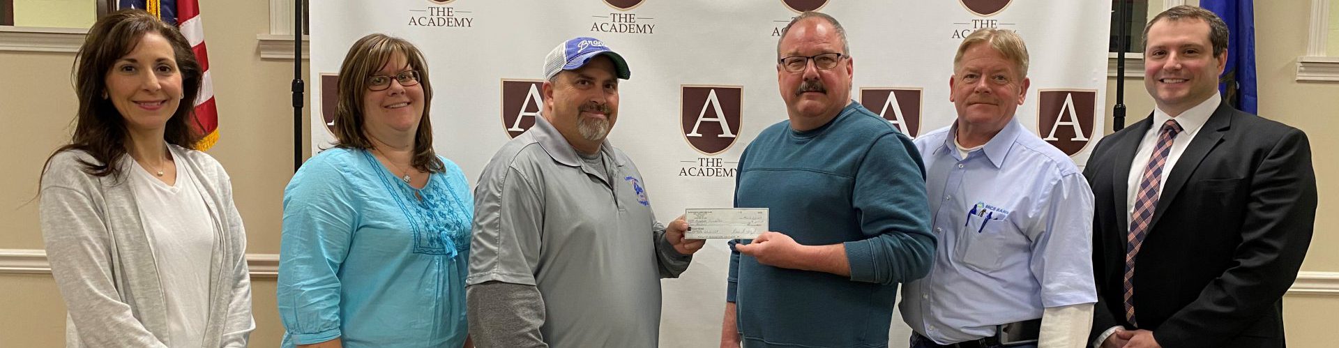 The Academy Foundation receiving a check